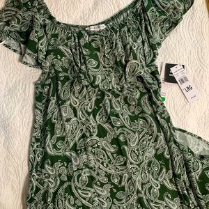 Sandra Darren dress that falls just below the knee.